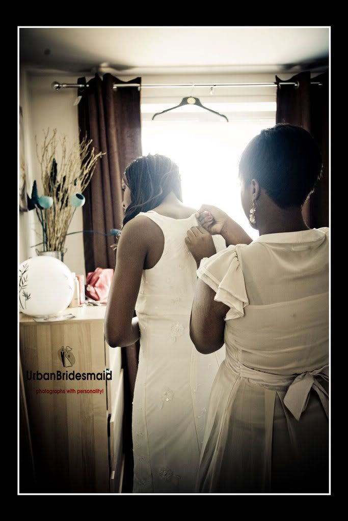 Bride adjusting dress